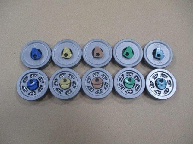 Example coins from each batch side by side, each anodized a different color