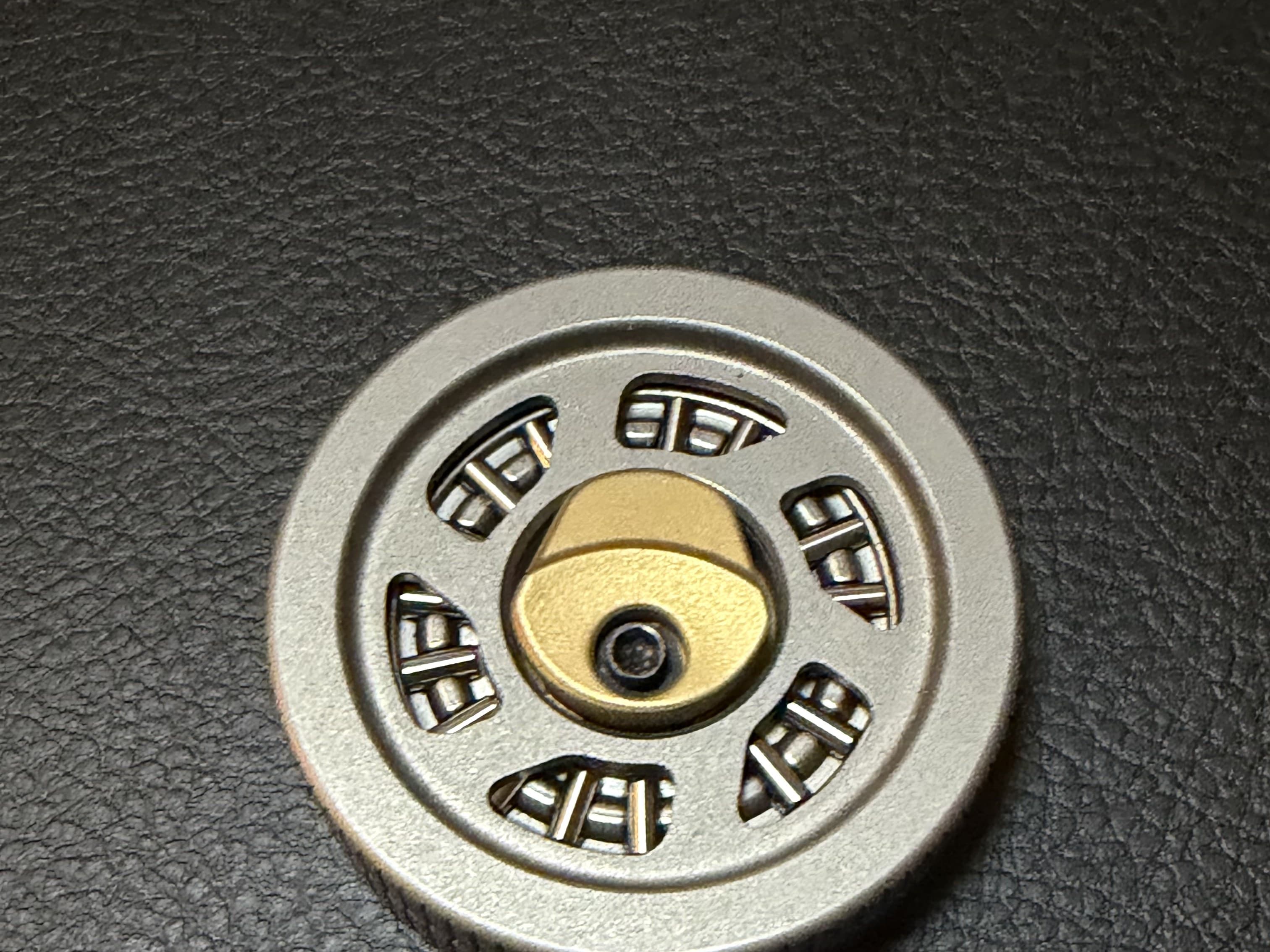 The Haptic Hubcap, machined from Grade 5 titanium